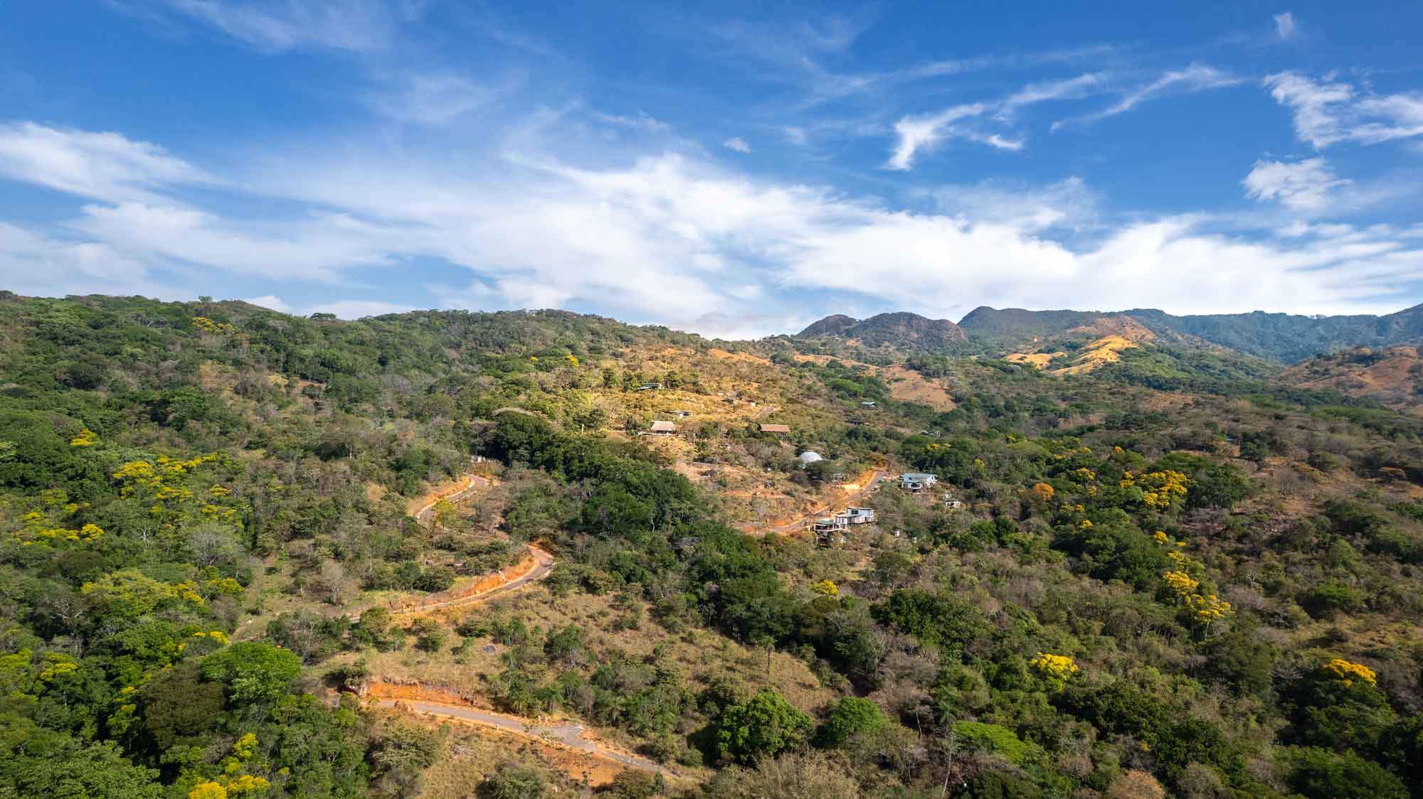 The Machuca Valley from the air, homes among forest and pasture