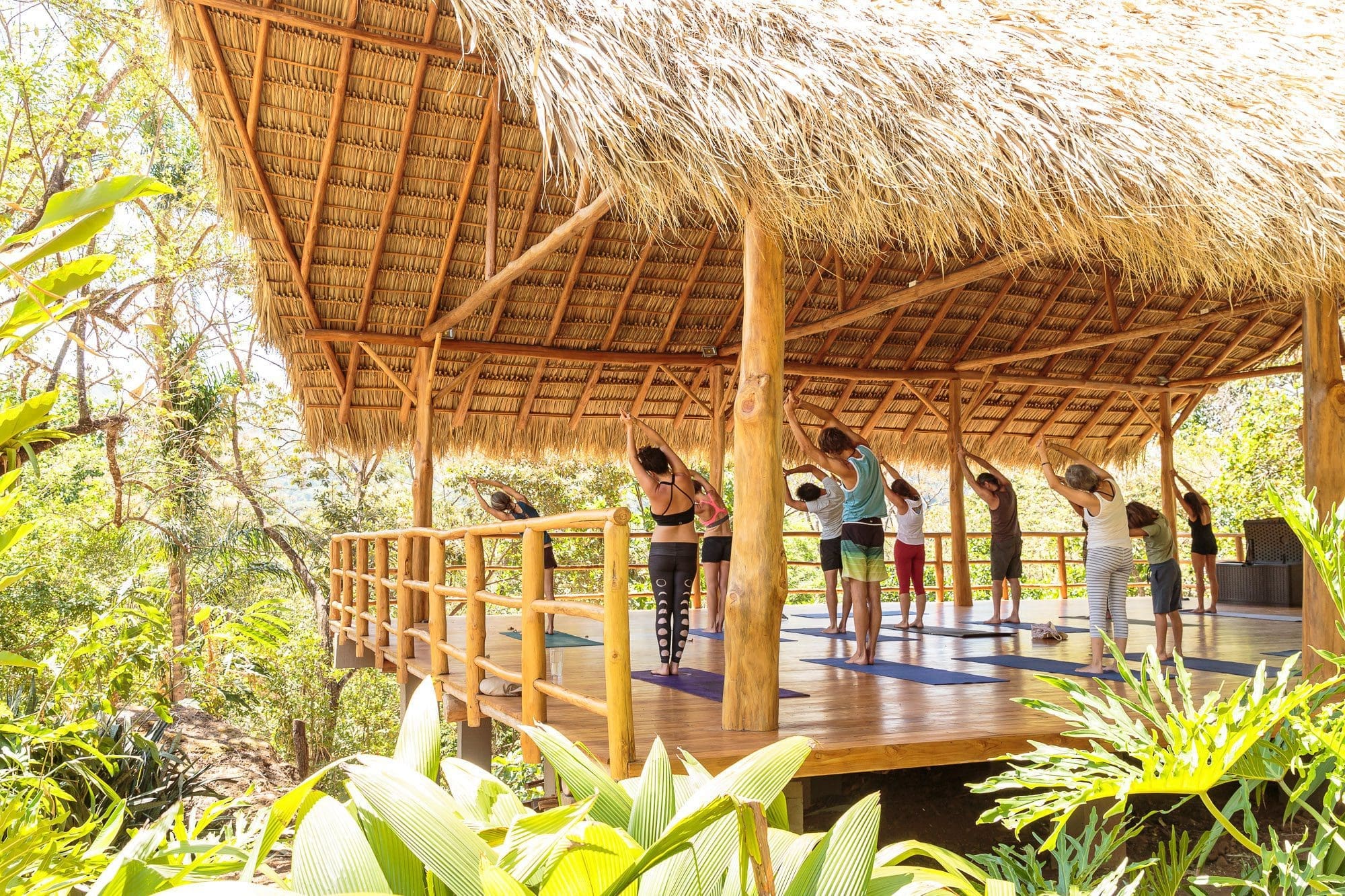 A morning yoga class in the shala at La Ecovilla
