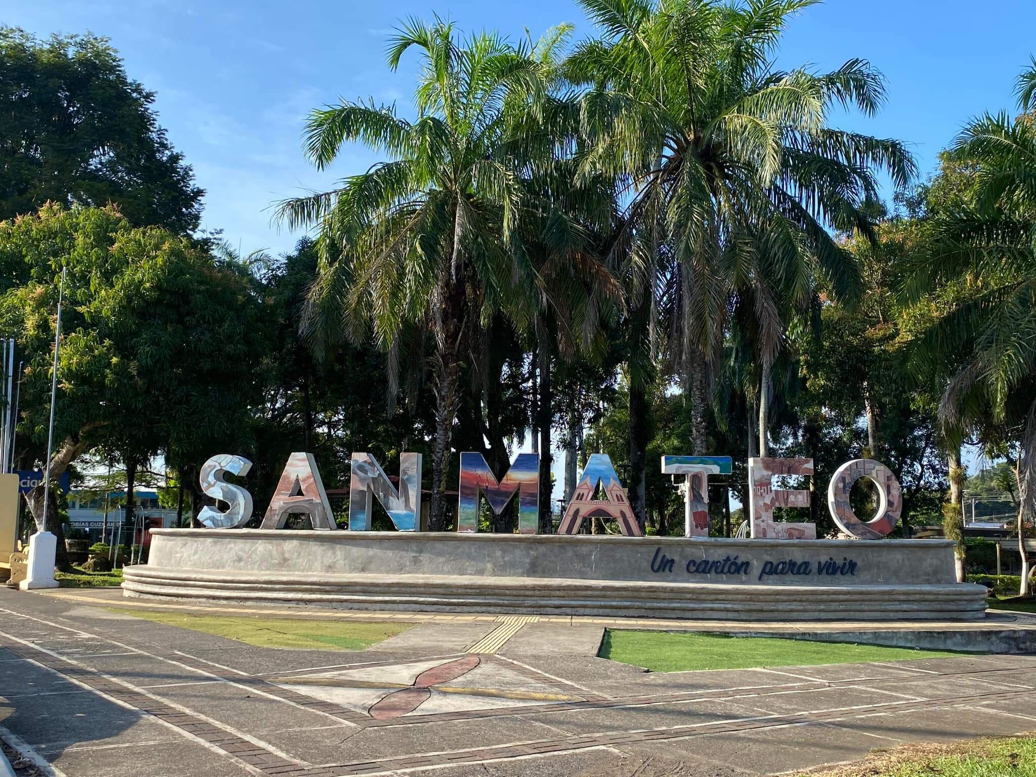 The San Mateo town sign among palms in the central park